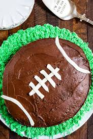 Football helmet four layers of cake carved to almost look like a helmet. Easy Football Cake Recipe Tutorial Crazy For Crust