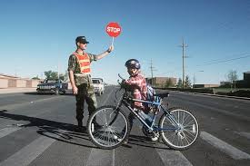 US Air Force SENIOR AIRMAN Terry Birnell, a volunteer crossing guard,  provides a friendly face