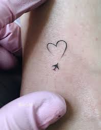We publish celebrity interviews, album reviews, artist profiles, blogs, videos, tattoo pictures, and more. Travel Tattoo And Heart Image 6616913 On Favim Com