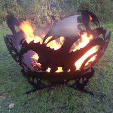 Relax by the warmth of an inviting fire on a cool summer night the fire pit is sure to be a vivid focal point on your patio or deck for many seasons to come! The Firepit Company Dragons A Bell Spherical Fire Pits
