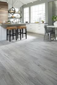 Laminate floor and water are not friends as you have found out and it is often better not to install it in areas that are potentially exposed to water. Kitchen With Grey Wood Floors And Brown Wood Floors Grey Wood Floors Living Room Living Room Wood Floor Gray Wood Tile Flooring