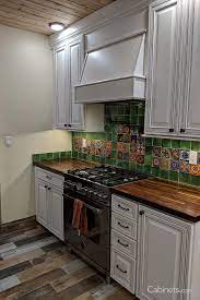 Transitional White Kitchen With A Mexican Tile Backsplash Cabinets Com Mexican Style Kitchens Mexican Tile Backsplash Mexican Tile Kitchen Backsplash