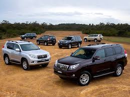 Though there is no longer a diesel, the gx has everything you need, the gxl adds a few more gadgets while the flagship cruiser is luxurious. Hd Wallpaper Toyota Suv Lot Trees Japan Australia Wallpaper Car Landscape Wallpaper Flare