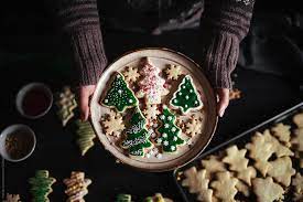 Struffoli, pizzelle, anginetti, cartellate, fig the best and most authentic italian christmas cookie recipes to help you celebrate christmas italian style. Woman Showing Just Decorated Christmas Cookies By Pixel Stories Christmas Cookie