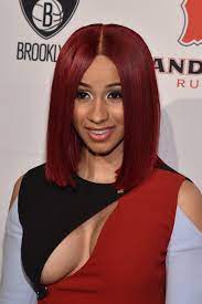 ($721) adorned with gold buttons, a sailor hat perched atop her platinum blond bob. Cardi B 2017 Hairstyles Essence