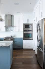 White Upper Cabinets With Blue Lower Cabinets With Pale Blue Glass Backsplash Tiles T Trendy Kitchen Backsplash Transitional Kitchen Glass Backsplash Kitchen