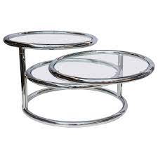 A milo baughman chrome console table, having a burl laminate rectangular top, above a thin rod frame, 27h x 58w x 16d. Milo Baughman Style Swivel Tiered Circles Coffee Table At 1stdibs