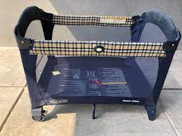 Graco travel trafficked cot blue