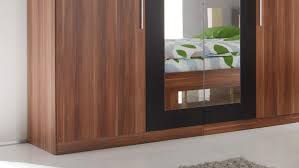 Kleiderschrank mit spiegel weiß & graphitfarben schwebetür und 2 drehtüren 4 schubladen 2 kleiderstangen modernes design jetzt online bestellen! Kleiderschrank Martina Walnuss Schwarz Mit Spiegel 228 Cm
