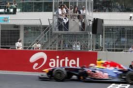 Sachin Tendulkar Waves The Chequered Flag For Sebastian Vettel Of Red Bull Racing Renault The First Ever Winner O Red Bull Racing Grand Prix Checkered Flag