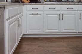 Bright White Raised Panel Cabinets With Brush Nickel Cabinet Handles From Atlas Hardware Paint Cabinets White Raised Panel Cabinets Kitchen Inspirations