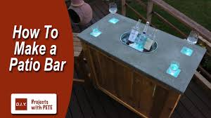 A bar table and barstools have tall straight angular an ingenious pub table featuring a flip up hinged central part of a top hiding a removable plastic ice cooler. 25 Diy Bar Table Projects How To Make A Bar Table