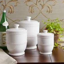 Each canister is crafted of metal with a white finish throughout and can hold up to 2.5 cups of your favorite coffees, teas, and sweeteners. Farmhouse Rustic White Kitchen Canisters Jars Birch Lane