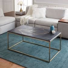 The marquetry top is made of 3 types of wood. Graphic Marble Inlay Coffee Table Black