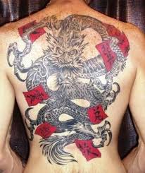 Black And Red Dragon Back Tattoo Black Grey Japanese Dragon With Red Flags Tattoo On Back Japanese Dragon Tattoo Dragon Tattoo Colour Black Dragon Tattoo