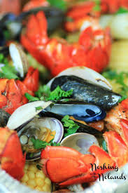 In a medium bowl stir together remaining ingredients, (except bay leaves and butter) pour over ingredients in roasting pan. Backyard Clambake On Your Grill Clam Bake Cooking Recipes Recipes