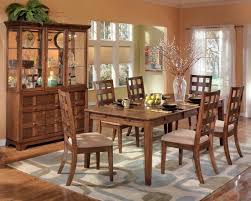 Exciting Salmon Dining Room Color With Decorative Wooden Furniture Set Plus Plaid Area Rug Pattern Idea Dining Room Would Be More Comfortable If You Use A Rug