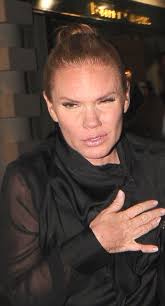 Victoria Beckham's lookalike sister Louise Adams looks partied out after a  night