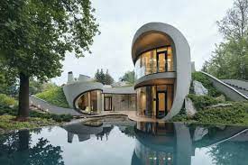 Tips the main trademark of contemporary architecture style consists of geometric shapes, asymmetric features, and natural building materials. Organic Meets Futuristic Architectural Design House In The Landscape