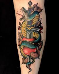Get all your favorite things on your thigh with a perfectly get this snake tattoo design with some geometrical designs in the background. Sword Tattoo Meanings Across The Globe Tattooswin