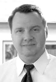 RESEARCHER ENJOYS WEARING TWO HATS