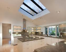 An array of gray hues add warmth to this white transitional kitchen while keeping the space neutral. 6 Most Amazing Skylight Ideas To Make Your Kitchen Look Spectacular My Decorative