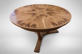A circular dining table that expands when rotated. Pippy Oak Expanding Circular Dining Table Johnson Furniture