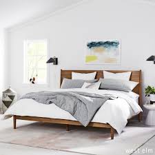Mid Century Bedroom With King Bed Industrial Wall Sconces White Walls And Organic Bedding Featured Wall Decor Bedroom Bedroom Wall Wall Sconces Living Room