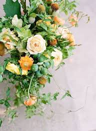 A white lantern with candles, a mason jar with burlap and lace, white blooms. Rustic Wedding Centerpiece Once Wed