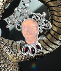 Almost done with this locket! It has been a long time in the works. I was  given free reign to make a locket, incorporating a snake, moonstone, and  runes. It needed to