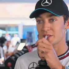 George Russell Laughing