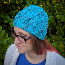 Ravelry: Knotted Roses Hat pattern by Sally-Jane Cameron
