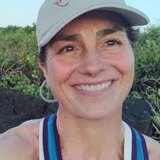 How do runners feel about the adjustment of Boston Qualifier times for net  downhill courses?