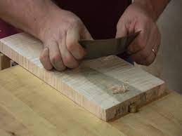 To use a card scraper, grip the card scraper between your two hands and push on the back of the card scraper with your two thumbs until it flexes slightly. Card Scrapers How To Sharpen And Use Chuck Bender Woodworking