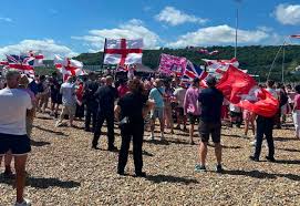 A man has appeared in court accused of striking a delivery driver with a traffic cone amid an anti-immigration protest.