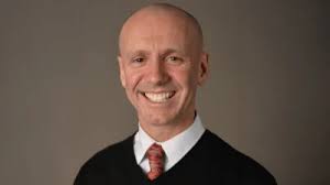 What did Warren Township High School District 121 teacher Thomas W. Witek  earn before leaving school?