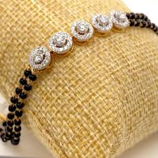 These customized gold mangalsutras made with hindi letters are truly unique. 17 Best Mangalsutra Bracelet Ideas In 2021 Mangalsutra Bracelet Black Beaded Jewelry Gold Mangalsutra Designs