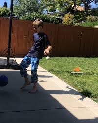 Ollie from Coach Sean Lines' 2010 team spent all day outside playing soccer  wearing his PJ’s, his Carlsbad shirt back to front and raising the bar