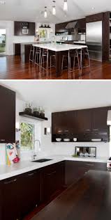 There are lots of contrasting finishes going on in this transitional kitchen—hardwood floors, a natural stone accent wall, dark grey cabinets and a waterfall marble island contribute to the unique rustic design. Dark Wood Kitchen Picture With White Worktop A Spicy Boy