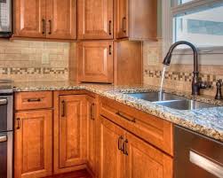 Honey Maple Cabinetry With Countertops U Shaped Kitchen With Medium Tone Woo Kitchen Remodel Countertops Kitchen Renovation Design Medium Wood Kitchen Cabinets