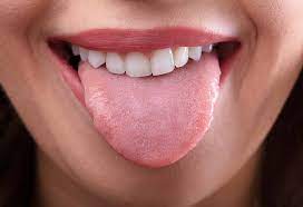 Special device to clean the tongue from plaque looks like a scraper. How To Clean Your Tongue Correct Methods Home Remedies