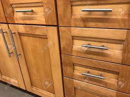 These pulls are not straight but curved. Contemporary Italian Kitchen Cabinet Design Made Of Maple Wood Stock Photo Picture And Royalty Free Image Image 125498366