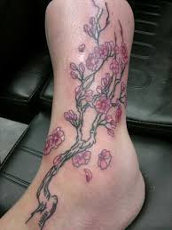 Cherry blossom tattoos are normally tattooed in the method of vines that wrap around any part of body or as the whole tree with blossoming flowers. Cherry Blossom Tattoo By Queenoofrandom On Deviantart