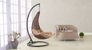 The rest of the room is done up in more neutral light grey walls, heavy grained wood plank flooring and a long desk set for two running along one whole wall. Danum Swing Chair Urban Ladder