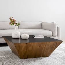Supported by a sturdy, yet minimalist. Angled Wood Coffee Table