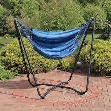 sunnydaze hanging rope hammock chair swing with space saving stand 330 lb weight capacity beach oasis in 2021 hammock swing chair hanging hammock chair swinging chair