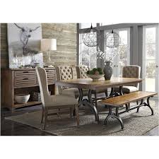The intricate balusters and grainy weathered surfaces of this gorgeous table lend it a sophisticated, classic look subtly updated to bring modern style and room for eight to your dining space. 411 T4274 Liberty Furniture Arlington House Trestle Table