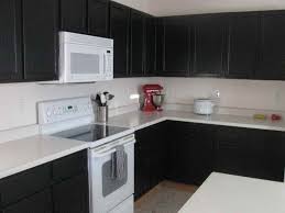 You can't even tell they are the same cabinets. Painting Kitchen Cabinets Black Before And After Painting Inspired