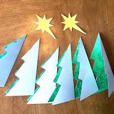 Curl the circle into a cone shape (pattern side up), overlap the ends, and tape the back. Diy Christmas Name Place Card Holders Shaped As A Tree