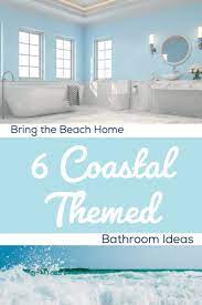Circular shaped mirrors and grid lights add an exciting component to this beach bathroom! Bring The Beach Home 6 Coastal Themed Bathroom Ideas Nebs